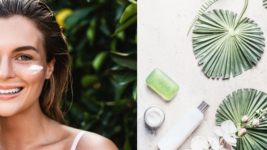 a woman in her 30s in a forest with a cream on her face next to a variety of natural skin care products