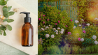 A stylish amber glass bottle with a pump dispenser on a light surface, surrounded by natural elements like eucalyptus leaves and smooth stones, against a backdrop of blooming flowers in a vibrant garden.