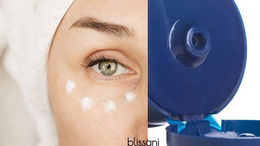 A woman in her 40's putting with wrinkle cream under eye next to a tube of skin cream