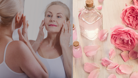 a woman in her 50s touching fine lines along her eyes next to a bottle of rose water and several roses.