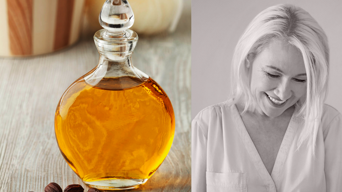jojoba oil in a glass vial next to a woman in her 50's looking downward